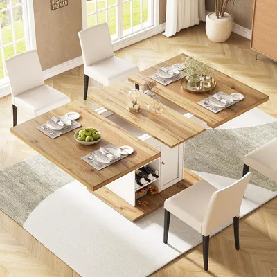 A dining set with an extendable table and chairs in a well-lit room with large windows.