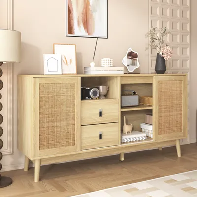 A wooden sideboard with rattan doors and drawers, decorated with various items in a living room setting.