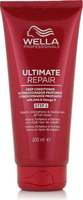 A red tube of Wella Professionals Ultimate Repair Deep Conditioner.