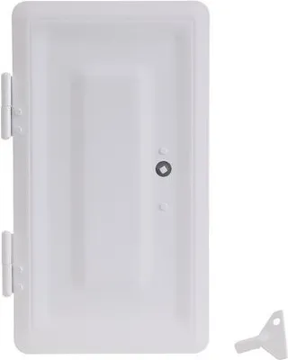 A white painted chimney door with a key.
