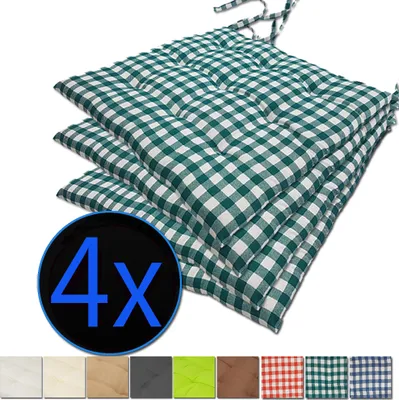 A stack of four green and white checkered seat cushions.