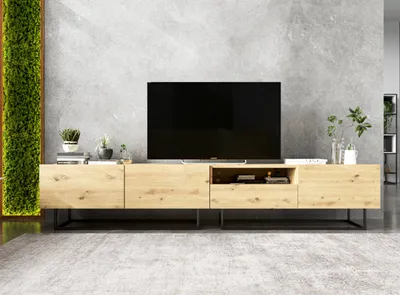 A modern living room with a TV stand and television.