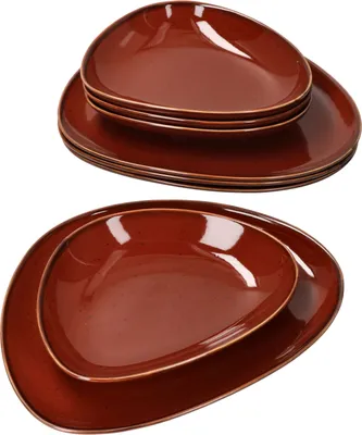 Two stacks of brown, teardrop-shaped plates are shown against a white background.