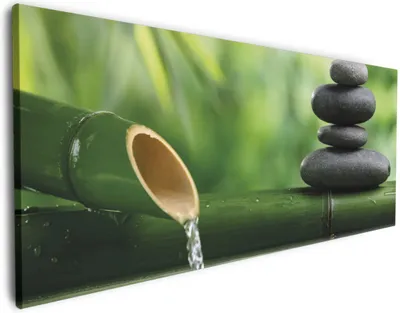 Produktbild von Wallario Premium Leinwandbild Steinstapel und Bambus auf dem Wasser in Größe 80 x 200 cm