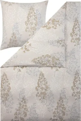 A flat lay of bedding with a pillow and a duvet cover, both featuring a leaf pattern.