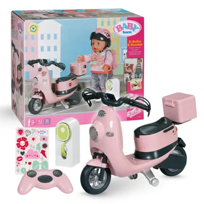 A BABY born E-Scooter toy set displayed with its packaging and accessories.
