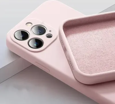 A close-up view of the back of a pink iPhone case, showing the camera cutout and the interior lining.