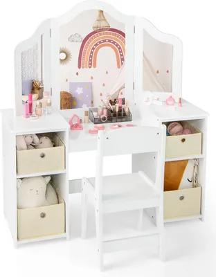 A white children's vanity table and chair set with toy makeup and stuffed animals.
