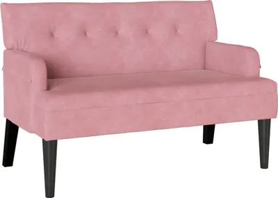 A pink Chesterfield sofa is shown against a white background.