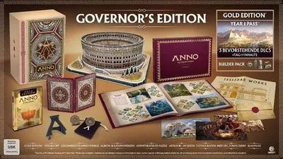 A collection of Anno 117: Pax Romana PC Governors Edition items, including a game box, a model of the Colosseum, a book, coins, and other promotional materials.