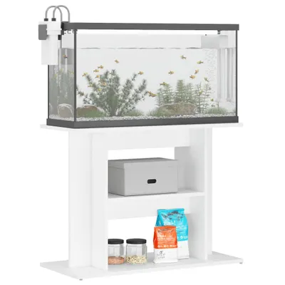 A white aquarium stand with an aquarium on top, containing fish and plants. The stand has shelves with storage items.