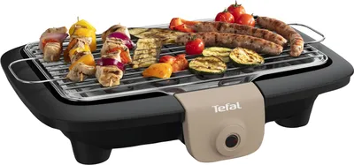 An electric grill with food on it, presented on a white background.