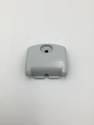 A light gray plastic part with a hole in the center and two slots at the bottom, set against a white background.
