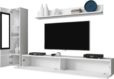 A modern white media wall unit with a TV, shelves, and storage cabinets, displayed against a white background.