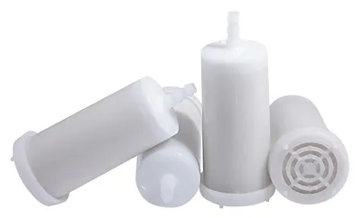 A group of white water softener cartridges on a white background.