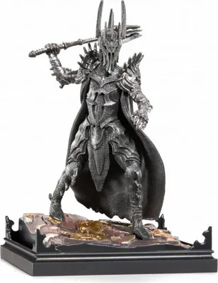 A detailed figurine of Sauron from Lord of the Rings, standing on a rocky base.