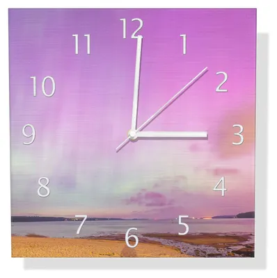 Produktbild von Wallario Design Wanduhr Leuchtende Lichter über Sandstrand aus Aluverbund, Größe 30 x 30 cm