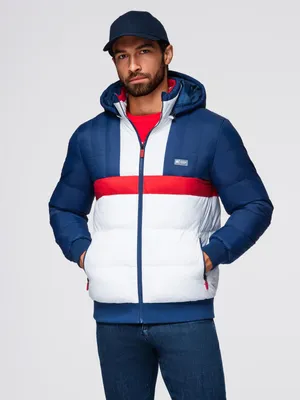 A man wearing a winter jacket and a baseball cap.