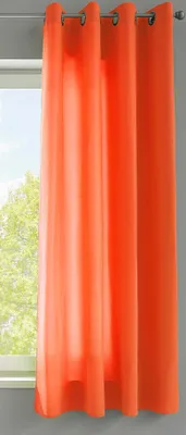 Orange curtains hanging in front of a window.
