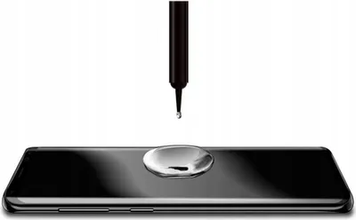 A drop of liquid is falling from a black applicator onto a black smartphone screen.