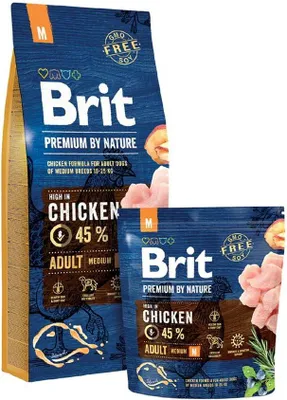 Two bags of Brit Premium By Nature dog food, one larger and one smaller, are shown against a white background.