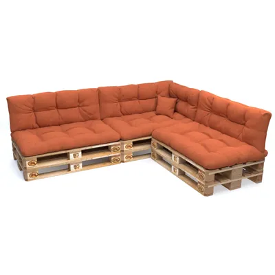 A sectional sofa made from wooden pallets with orange cushions, shown against a white background.