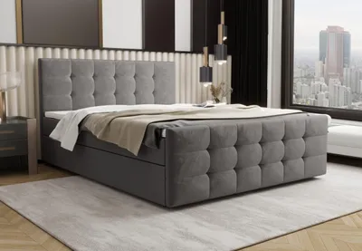 A modern bedroom with a large upholstered bed and a city view from the window.