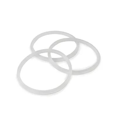 Three white silicone rings are arranged in a pile on a white background.
