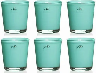 Six turquoise glass candle holders arranged in two rows of three.