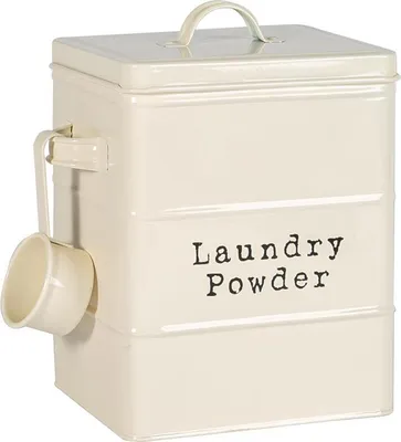 A cream-colored metal canister for laundry powder, with a scoop attached.