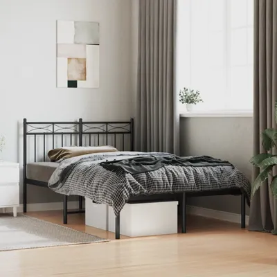 A bedroom with a metal bed frame and bedding.