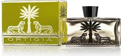 A bottle of perfume and its packaging are displayed side-by-side on a white background.