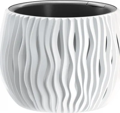 A white planter with a wavy, textured exterior and a black interior.