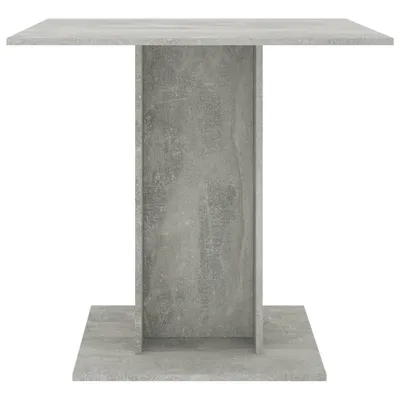 A concrete-effect dining table against a white background.