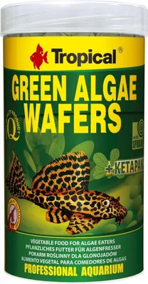 A cylindrical container of fish food with a label showing the brand, product name, and an image of a fish.