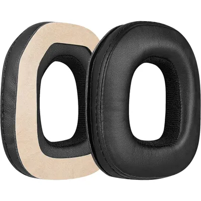 Two black ear pads for headphones are shown side-by-side against a white background. One ear pad is shown from the side, revealing its beige inner padding, while the other is shown from the front.