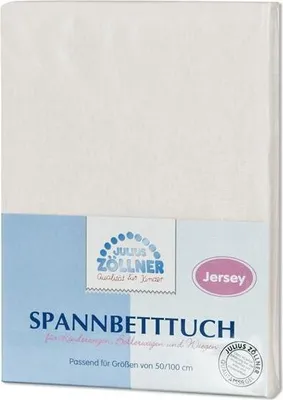A white baby bed sheet folded and packaged with branding.