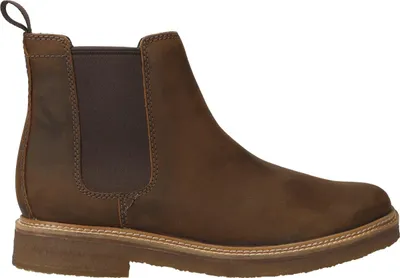 A side view of a brown leather Chelsea boot.