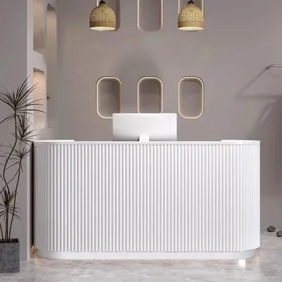 A modern reception desk in a clean, minimalist setting.