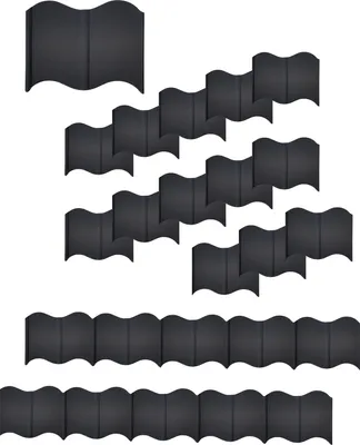 Multiple black garden edging pieces arranged in a wavy pattern.
