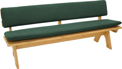 A dark green bench cushion set on a wooden bench.