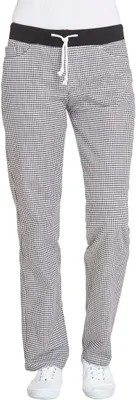 A person wearing checkered pants and white sneakers against a white background.