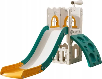 A children's playground set designed to look like a castle, featuring slides and climbing elements.