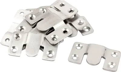 A pile of metal furniture connectors and one connector shown separately on a white background.