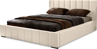 A beige upholstered bed with brown bedding and pillows, shown from a diagonal angle against a white background.