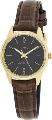 A close-up studio shot of a gold-toned Casio women's watch with a black dial and a brown alligator-patterned leather strap.