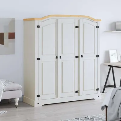 A white wardrobe with a wooden top is shown in a room setting.