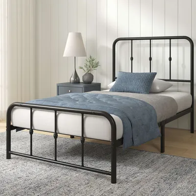 Zinus Schwarzes Metallbett mit abgerundeten Kanten in eingerichtetem Schlafzimmer mit blauer Bettwäs