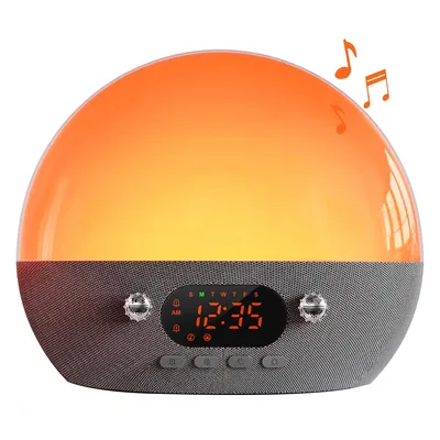 A wake-up light alarm clock with a speaker and digital display.