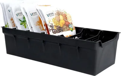 A black plastic organizer tray holding several packets of spices or seeds.